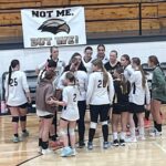 Falkner erases two-set deficit to beat Wheeler; Walnut, Ripley sweep Falkner volleyball players gather in a team huddle beside the bench.