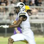 Tough Friday for Tippah: Ripley, Falkner and Walnut take first losses A football player in a white uniform carries the ball with a defender behind him.