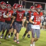 Walnut at Alcorn Central: Wildcats chase win No. 91 for John Meeks Walnut Wildcats football players in red jerseys jog onto the field under the lights before the Wildcats' 2026 game against Alcorn Central